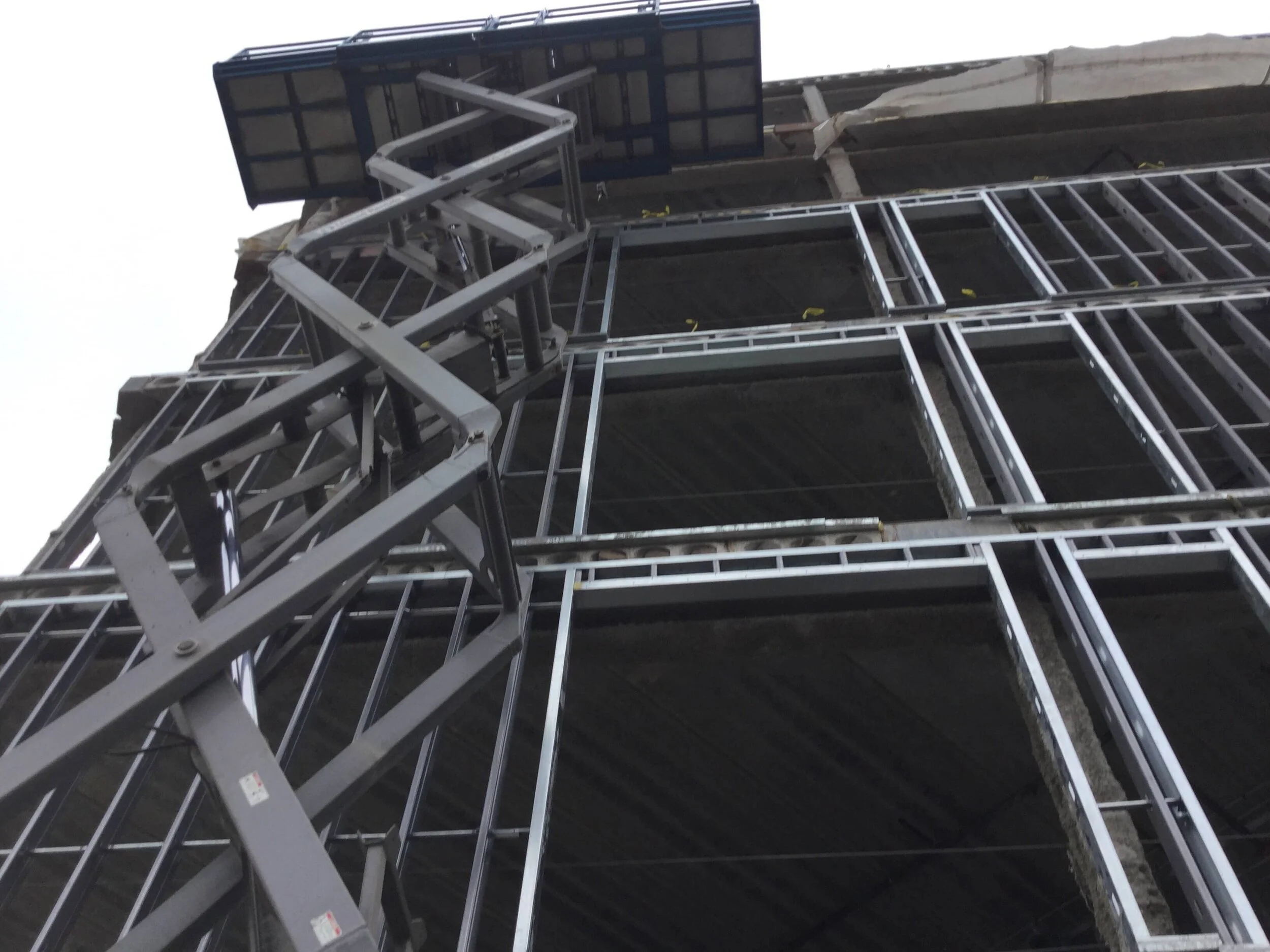 Looking up at multi-story metal stud framing — 1920 Milwaukee Ave, Chicago
